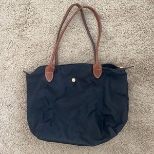 Medium sized black longchamp bag